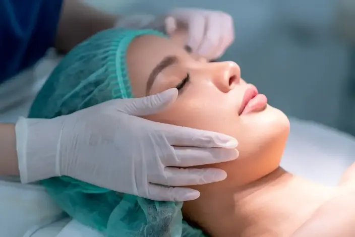a woman getting a facial injection at the beauty salon