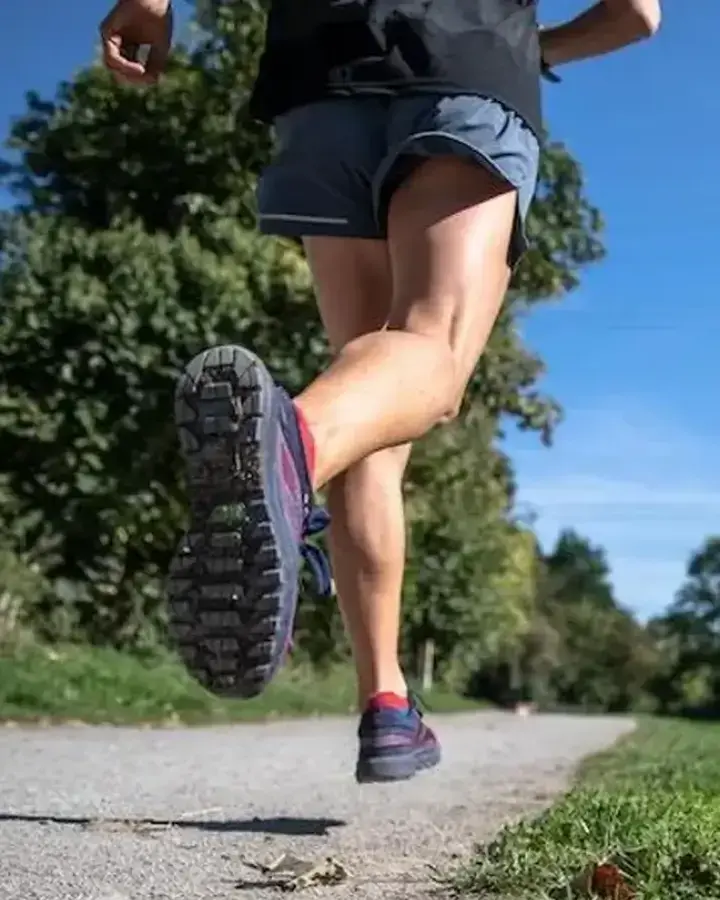 a woman running on a path