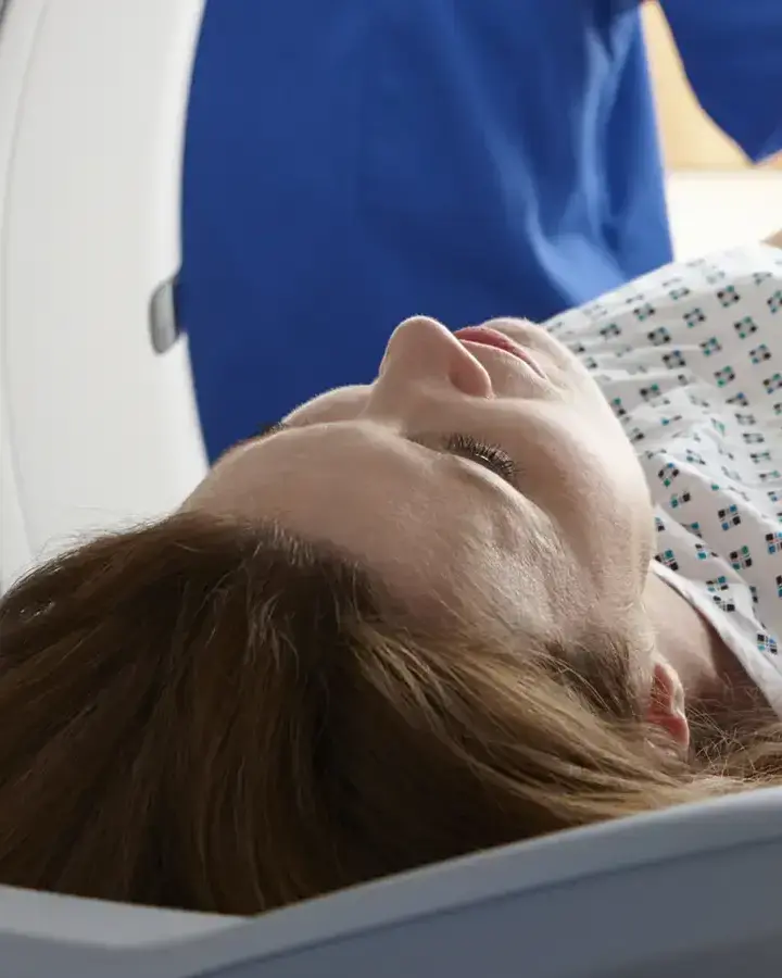 a woman laying in a hospital bed
