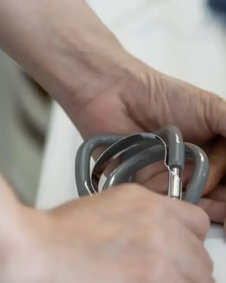 nurse holding elderly man's hand