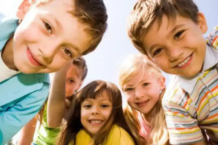 five smiling children