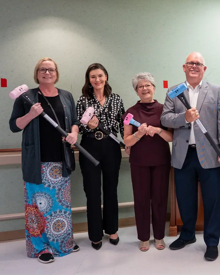 group-of-men-and-women-with-sledgehammers