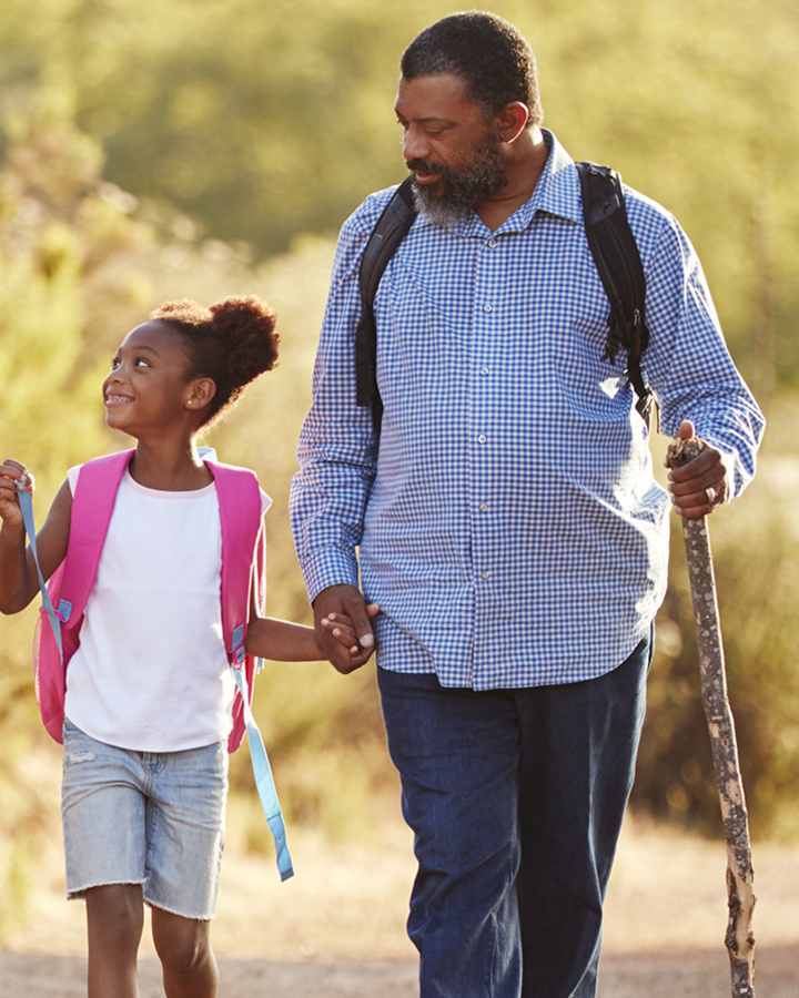 grandparents-with-grandchildren-wearing-backpacks