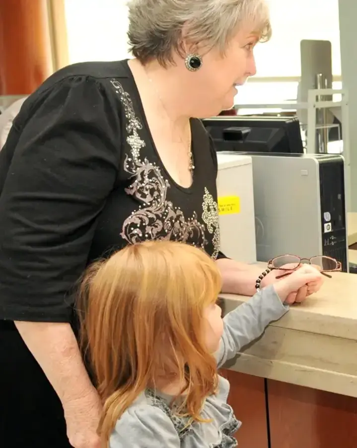 woman and child at reception desk