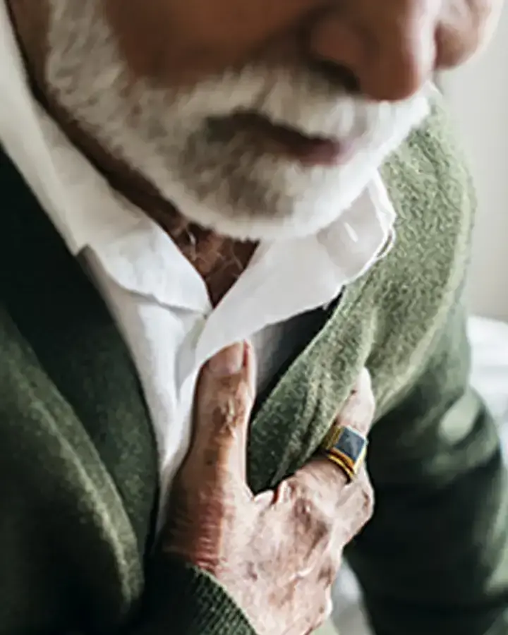 a man wearing a green sweater