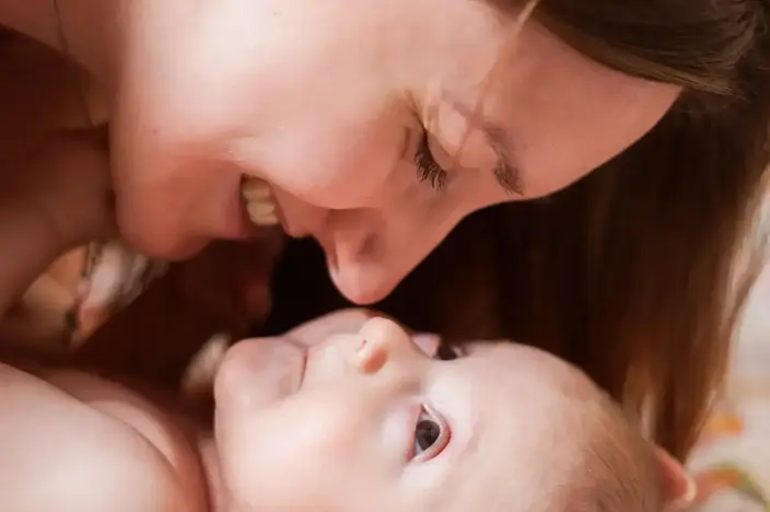 close up of mother with baby