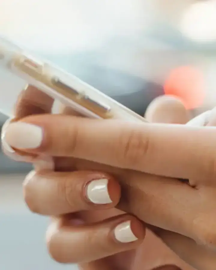 close up woman checking cell phone