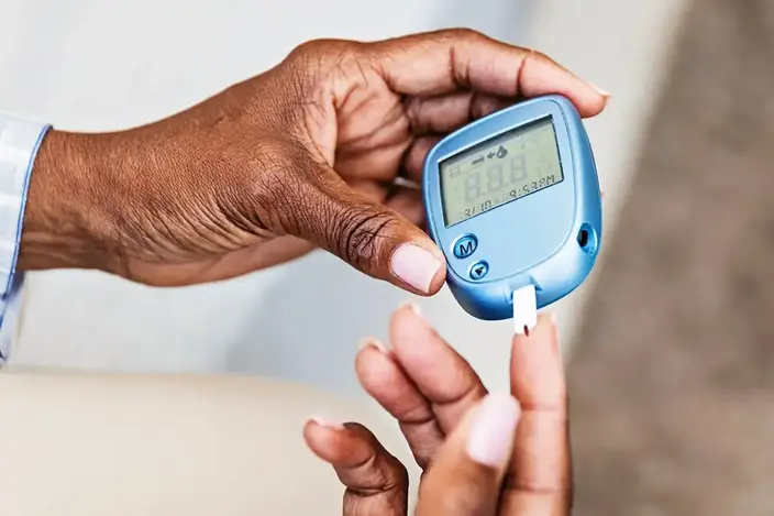 woman checking glucose level