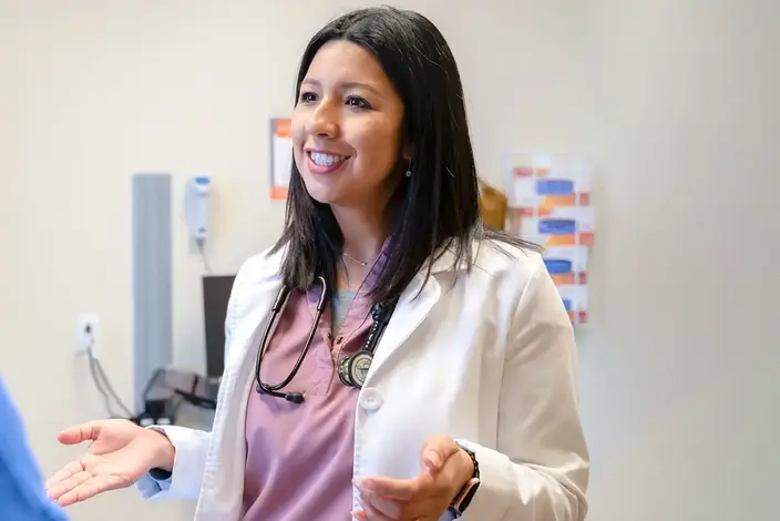 a woman talking to a doctor