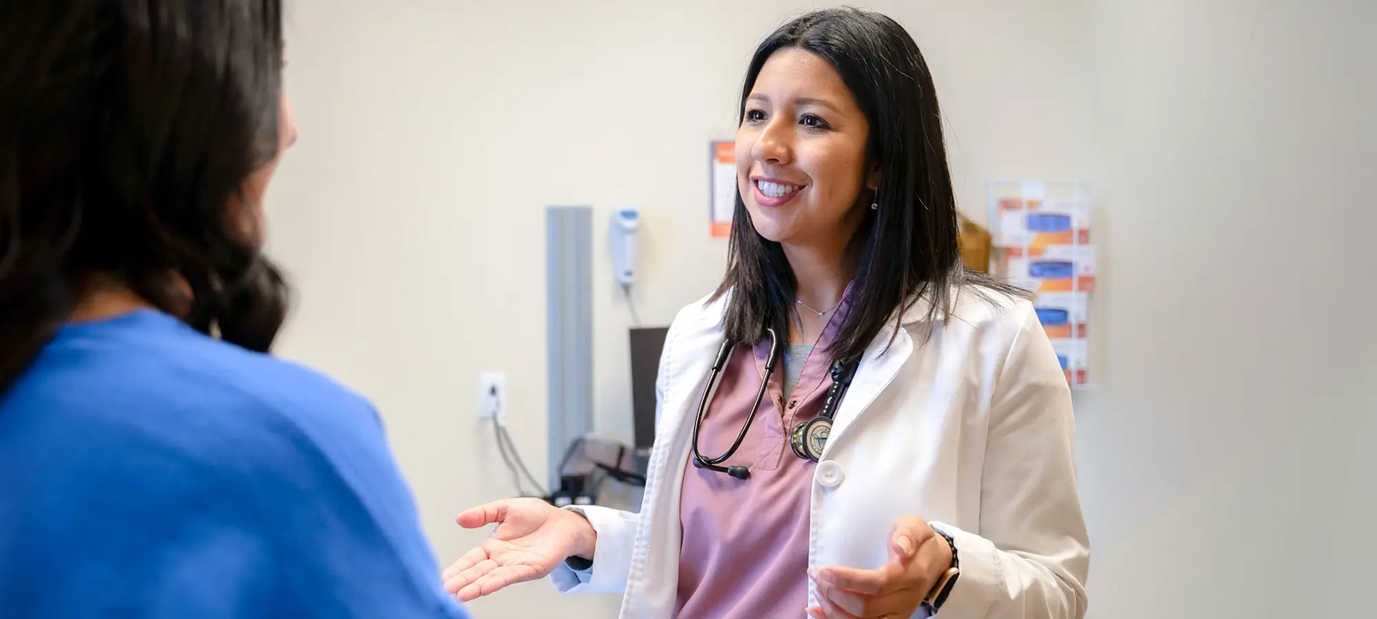 a woman talking to a doctor