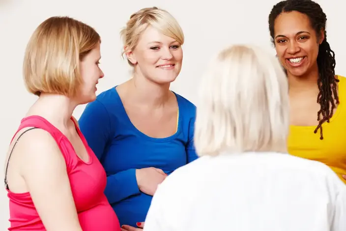 a group of people sitting in a circle